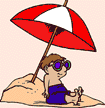 Image of boy sitting on beach under an umbrella